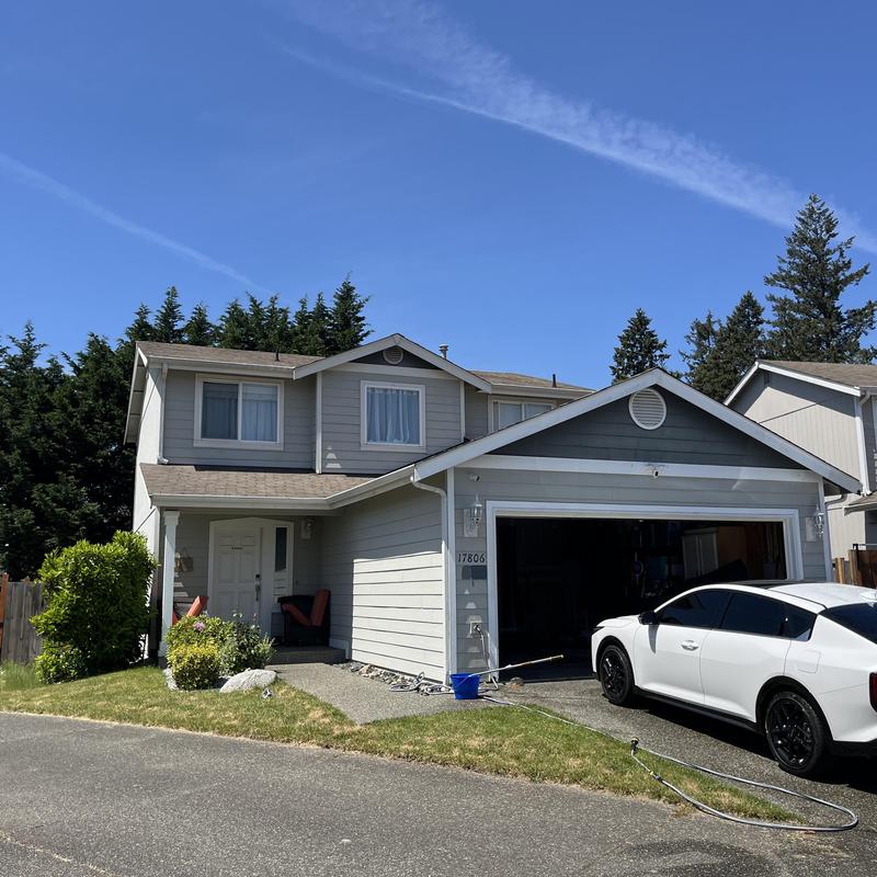 Asphalt shingle roof on two-story suburban house Asphalt shingle roof on two-story suburban house