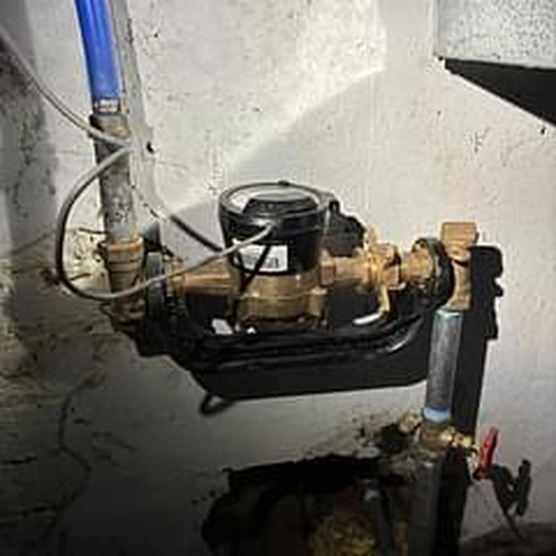 Water meter with expansion fitting removed and reassembled