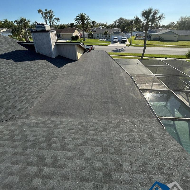 Black modified bitumen flat roof with black shingles Black modified bitumen flat roof with black shingles