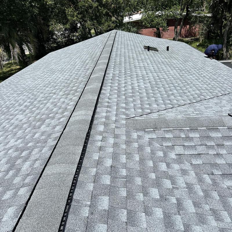 Architectural shingle roof with ridge vent installation Architectural shingle roof with ridge vent installation