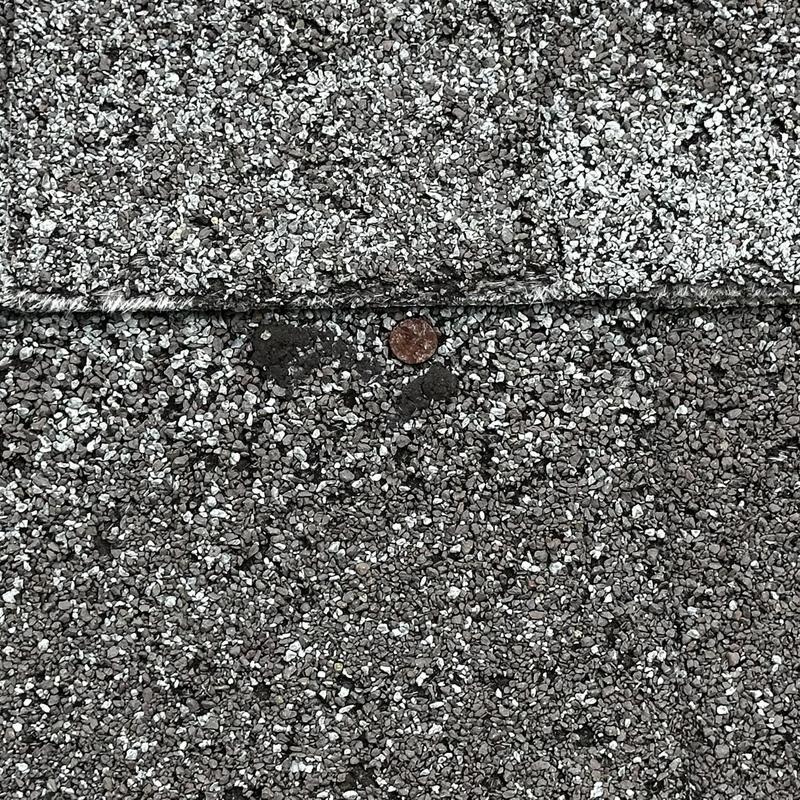 Roof shingles with repaired loose flashing and nail sealant Roof shingles with repaired loose flashing and nail sealant