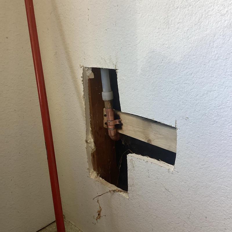 Copper water pipe with drywall access cutout
