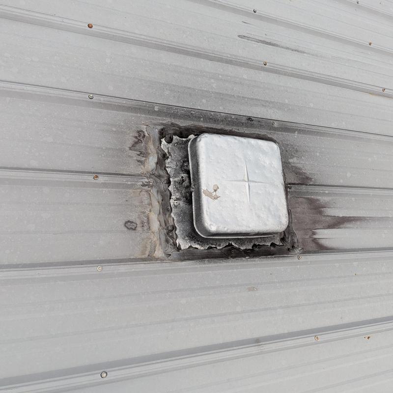 Metal roof vent with improper sealing and rust marks Metal roof vent with improper sealing and rust marks