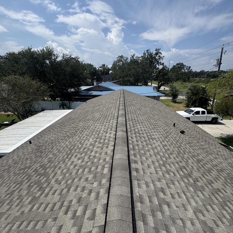 Architectural shingle roof with continuous ridge venting Architectural shingle roof with continuous ridge venting