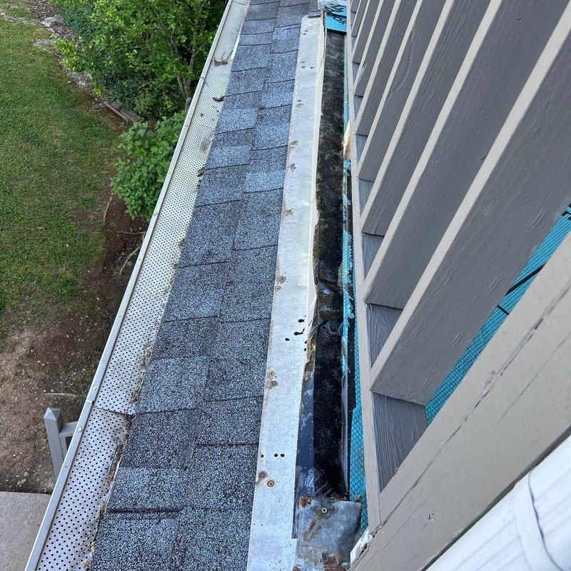 Metal flashing and shingle roof with hail damage evaluation