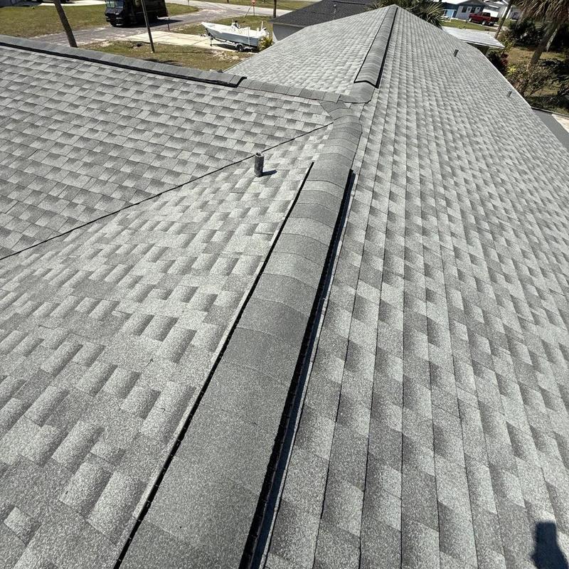 Architectural shingle roof with ridge vent installation Architectural shingle roof with ridge vent installation