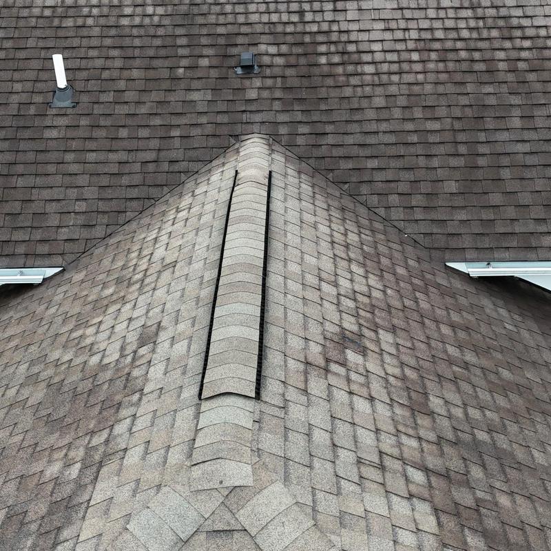 Asphalt shingle roof ridge and flashing inspection