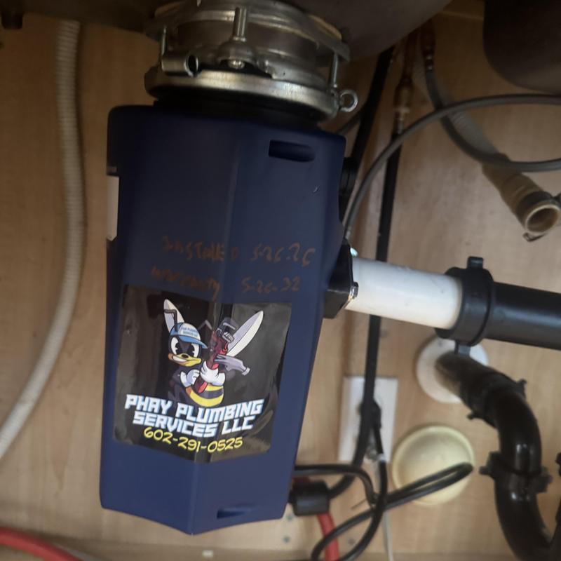 Garbage disposal installation with plumbing pipes