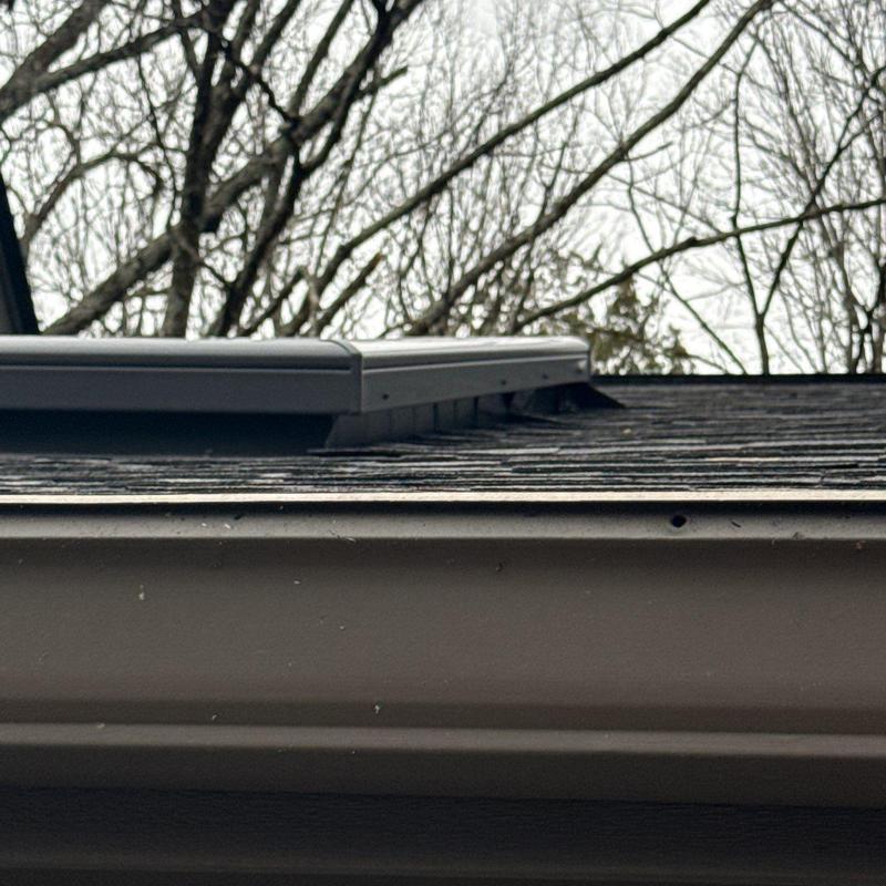 Roof shingles with hail damage and ridge caps