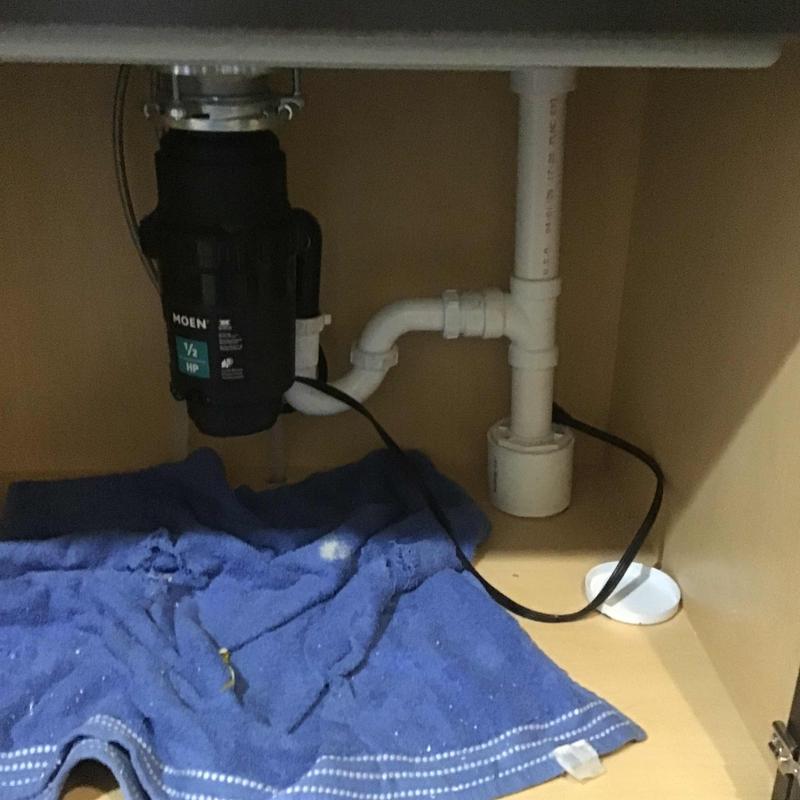 Kitchen sink garbage disposal and drain piping trim out