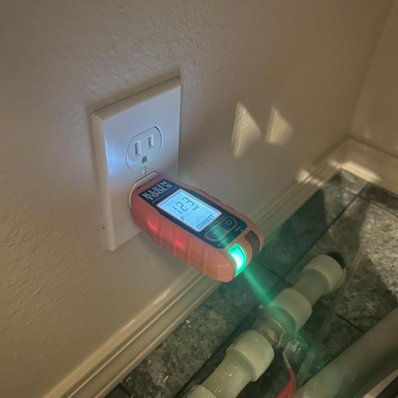 120V electrical outlet voltage tester in wall socket