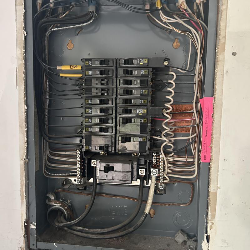 Electrical panel with circuit breakers and wiring inside