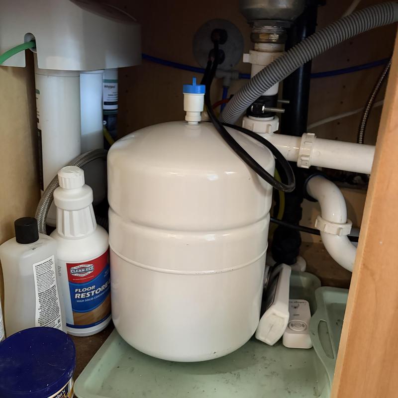 Water heater expansion tank and drain pipes under sink