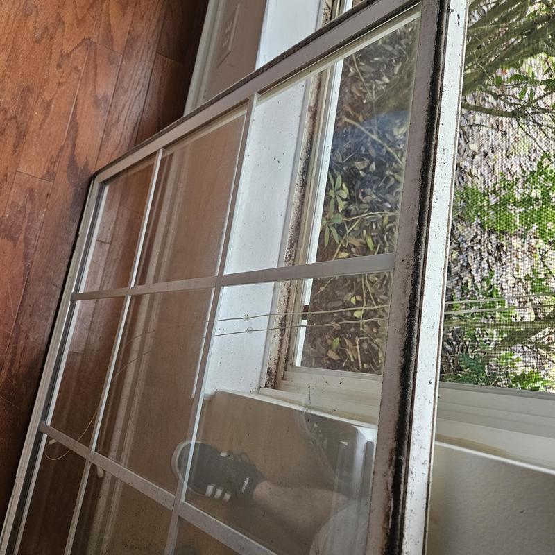 Window glass panel with grid removed from frame Window glass panel with grid removed from frame