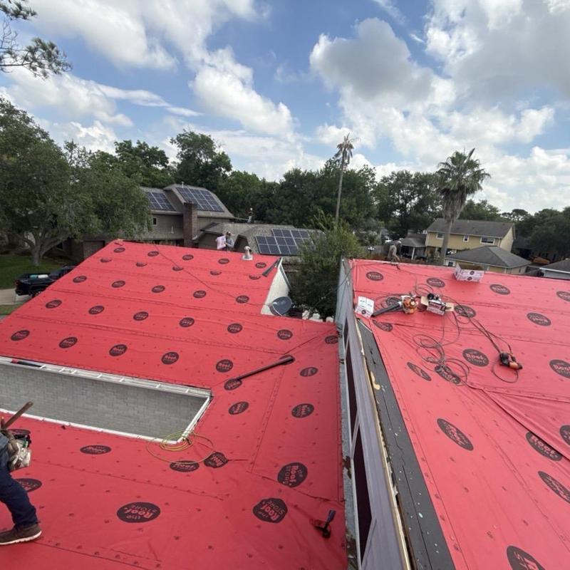 Synthetic roofing underlayment installed on residential roof