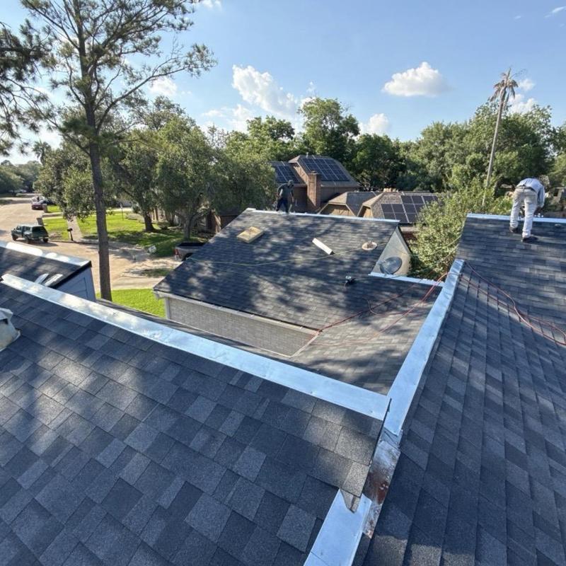 Architectural shingle roof with metal flashing installation