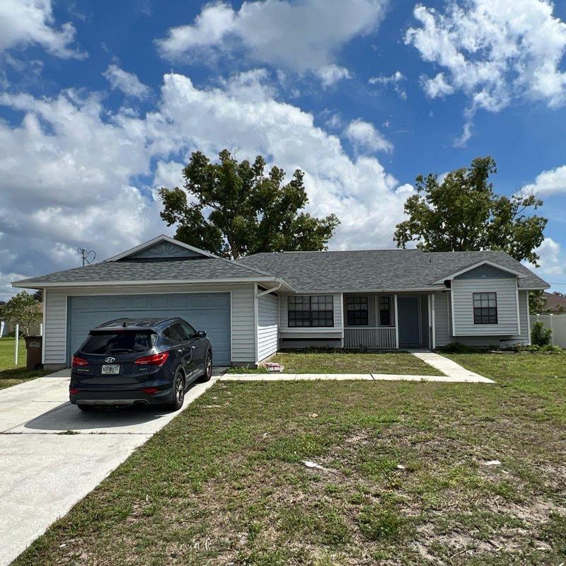 Shingle roof with gray asphalt shingles on home Shingle roof with gray asphalt shingles on home