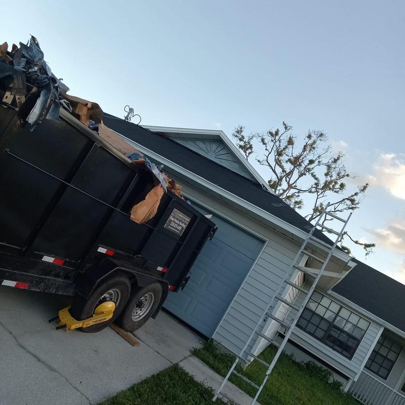 Shingle roof replacement with dumpster and ladder Shingle roof replacement with dumpster and ladder