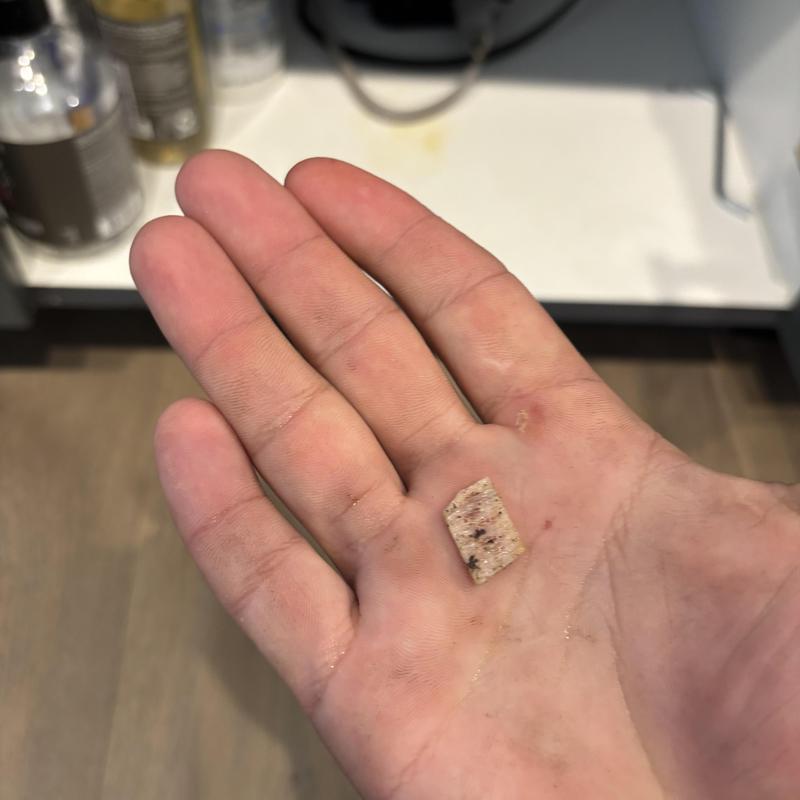Garbage disposal bone fragment removal in hand