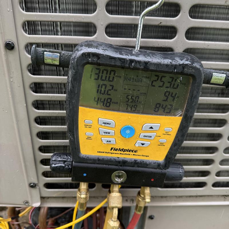 Refrigerant manifold gauges on HVAC condensing unit Refrigerant manifold gauges on HVAC condensing unit