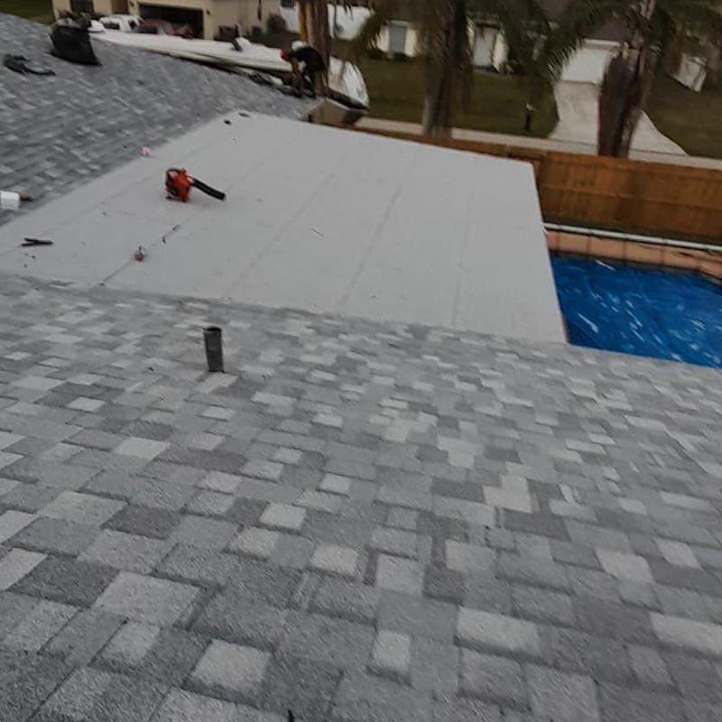 Shingle roof and flat membrane roofing installation Shingle roof and flat membrane roofing installation