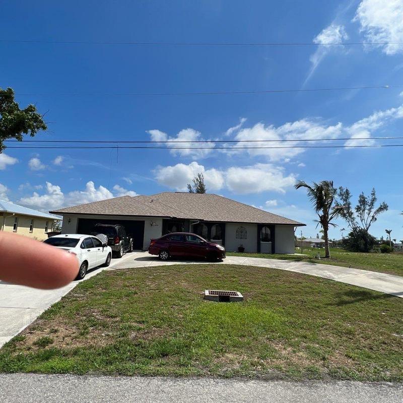 Shingle roof and driveway at suburban home in Cape Coral Shingle roof and driveway at suburban home in Cape Coral