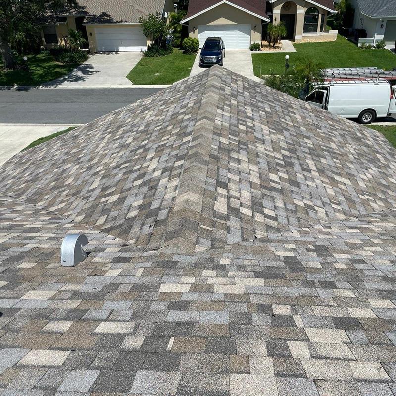 Asphalt shingle roof with new ridge cap installed Asphalt shingle roof with new ridge cap installed