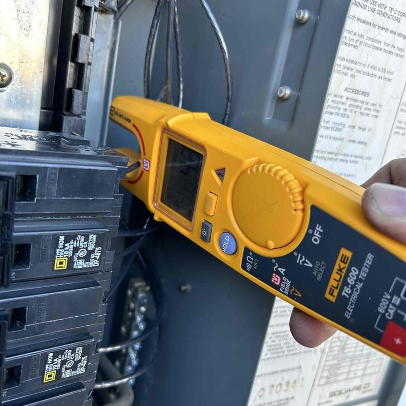 Square D HOM breakers with electrical tester in panel
