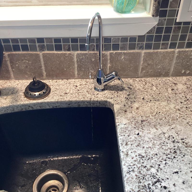 Reverse osmosis faucet installation above kitchen sink