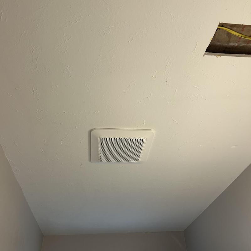 Bathroom exhaust fan installation with attic access cut