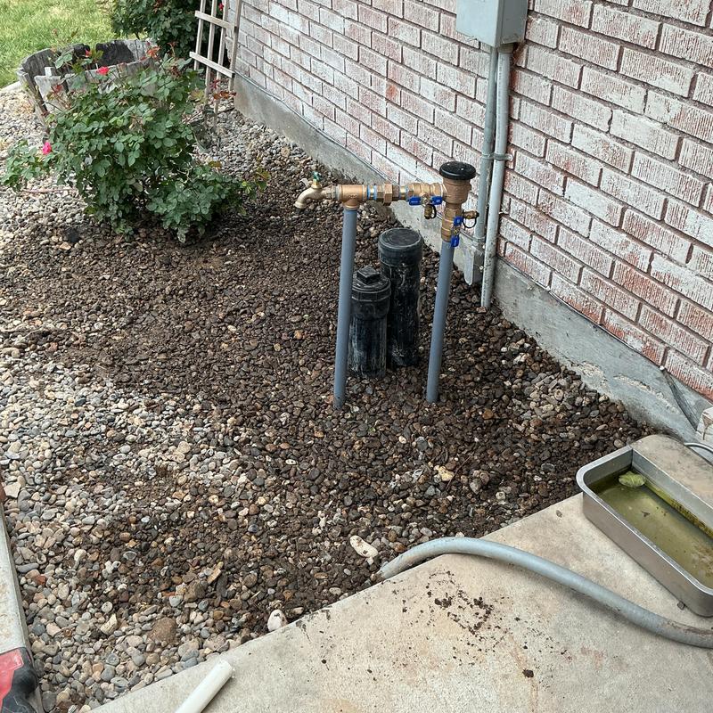 PVB backflow preventer with broken fitting outdoors