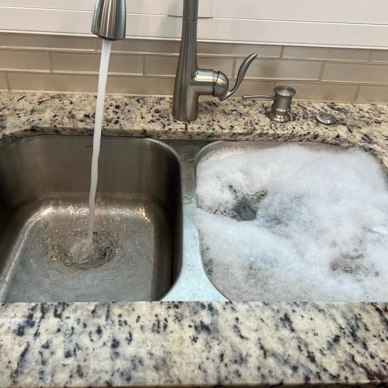 Kitchen sink drains flushing with hot, soapy water