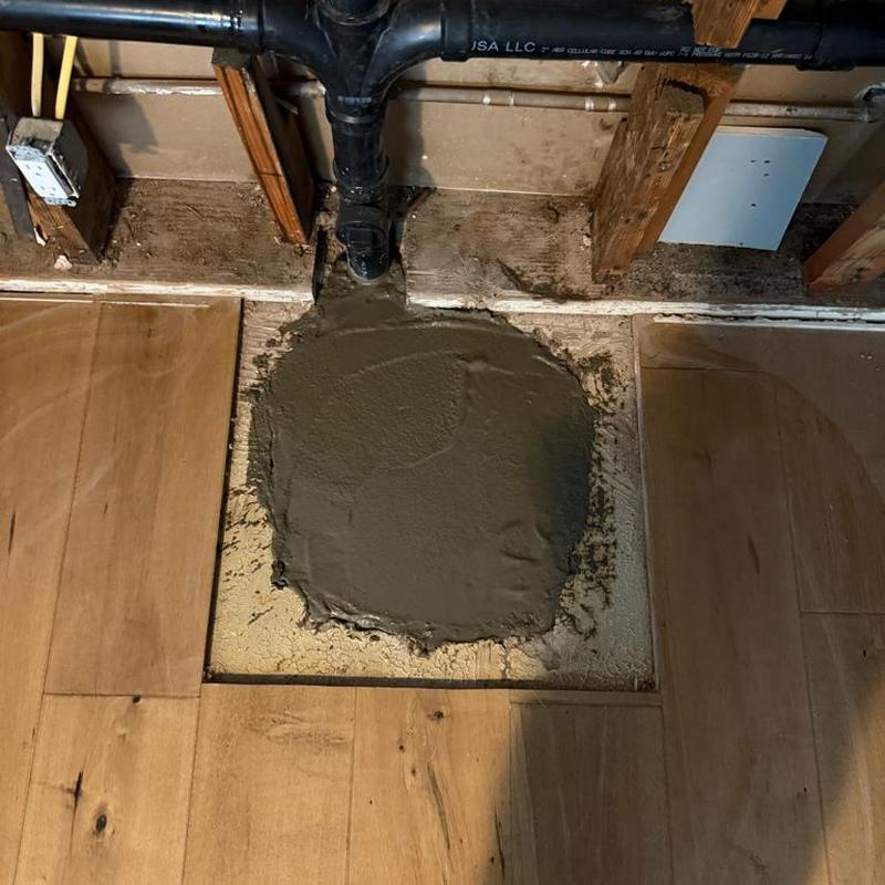 Cast iron drain pipe repair with concrete patch Cast iron drain pipe repair with concrete patch