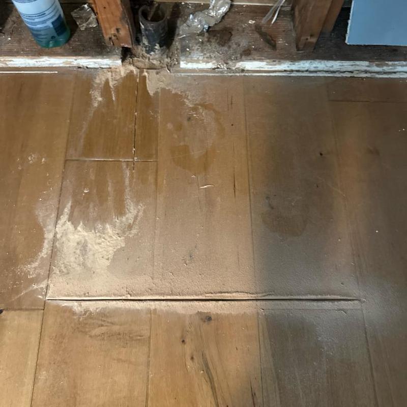 Cast iron drain pipe exposed and floor cut for repair Cast iron drain pipe exposed and floor cut for repair