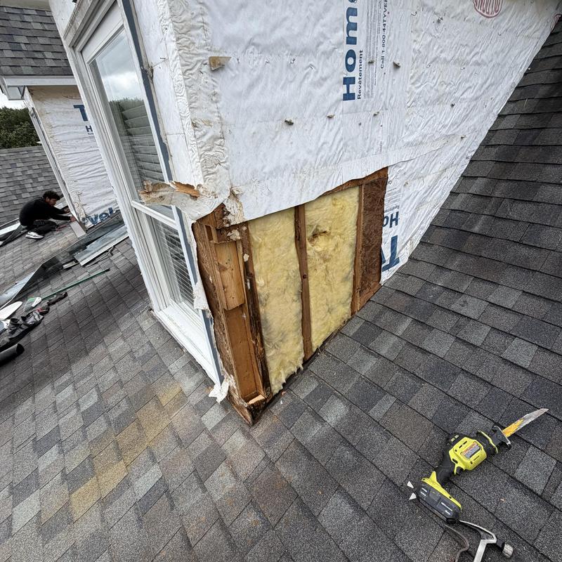 Dormer siding removal with exposed insulation and flashing