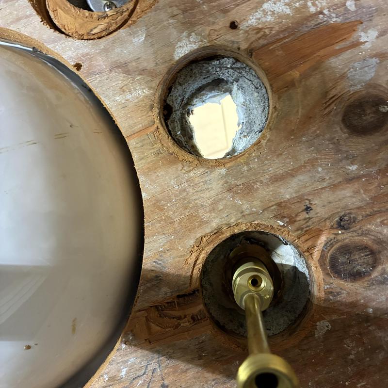 Basin faucet supply line through countertop holes