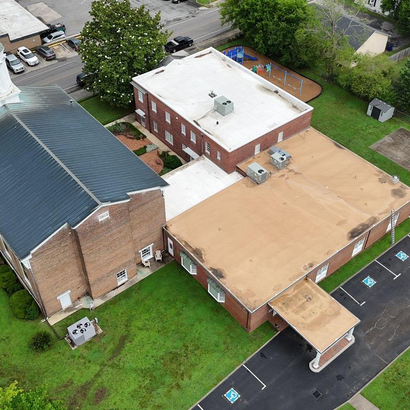 PVC flat roof with ponding water on church building