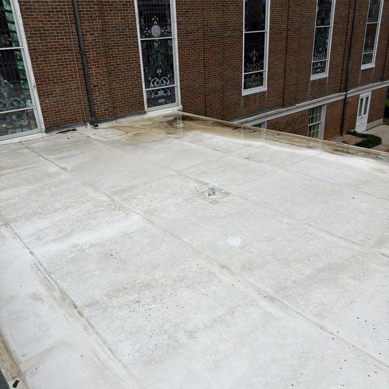 PVC roofing system with ponding water near church walls