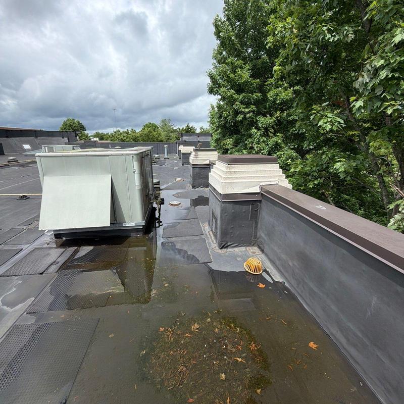 EPDM roof with ponding water near rooftop unit