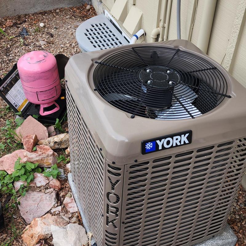 York air conditioner unit with refrigerant tank outdoors