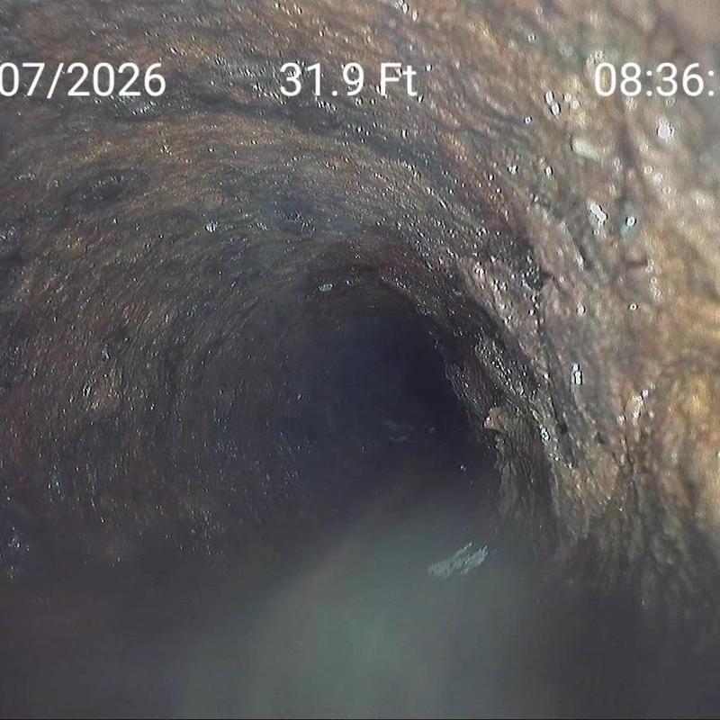 Cast iron sewer line interior at 31.9 feet depth Cast iron sewer line interior at 31.9 feet depth