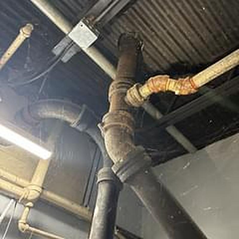 Cast iron sewer pipes and fittings in ceiling space