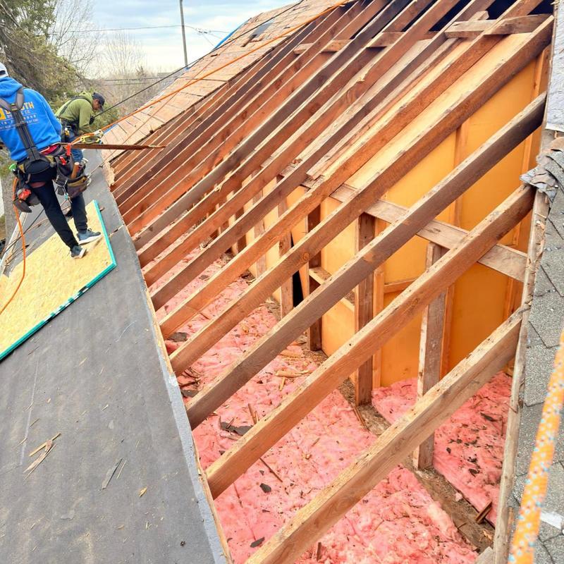 Roof sheathing installation with OSB panels in progress