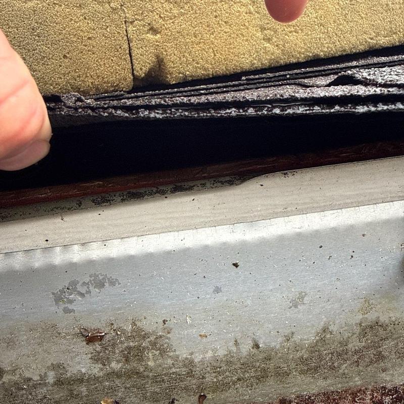 Asphalt shingles and metal flashing inspection with damage