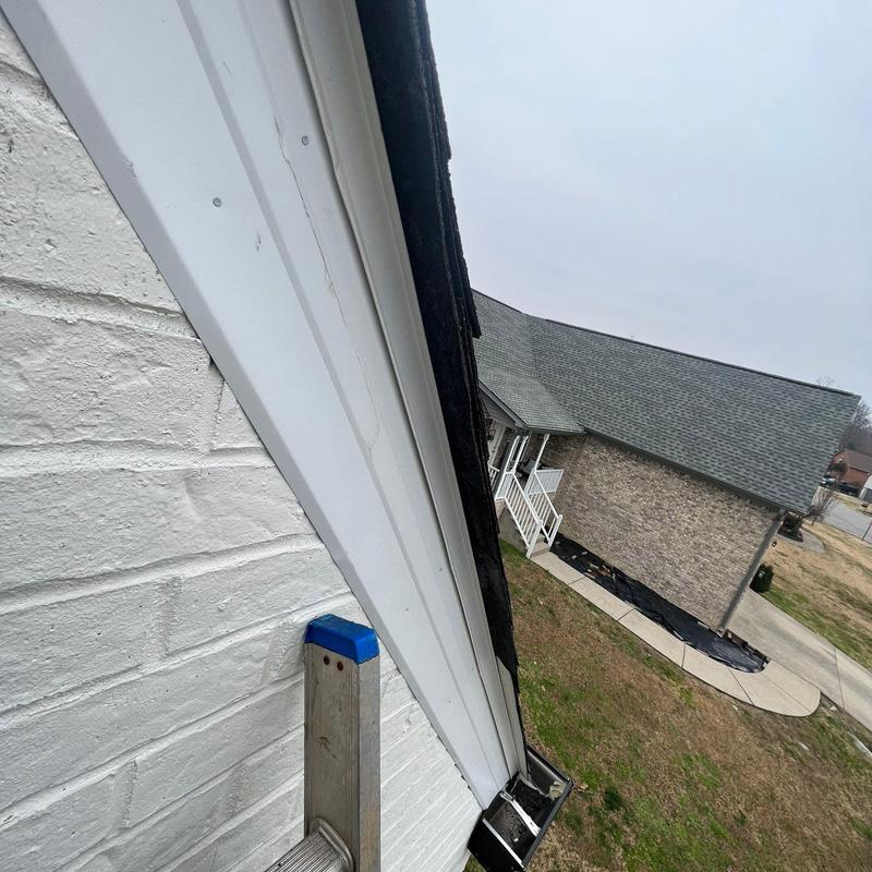Roof flashing inspection on residential home exterior