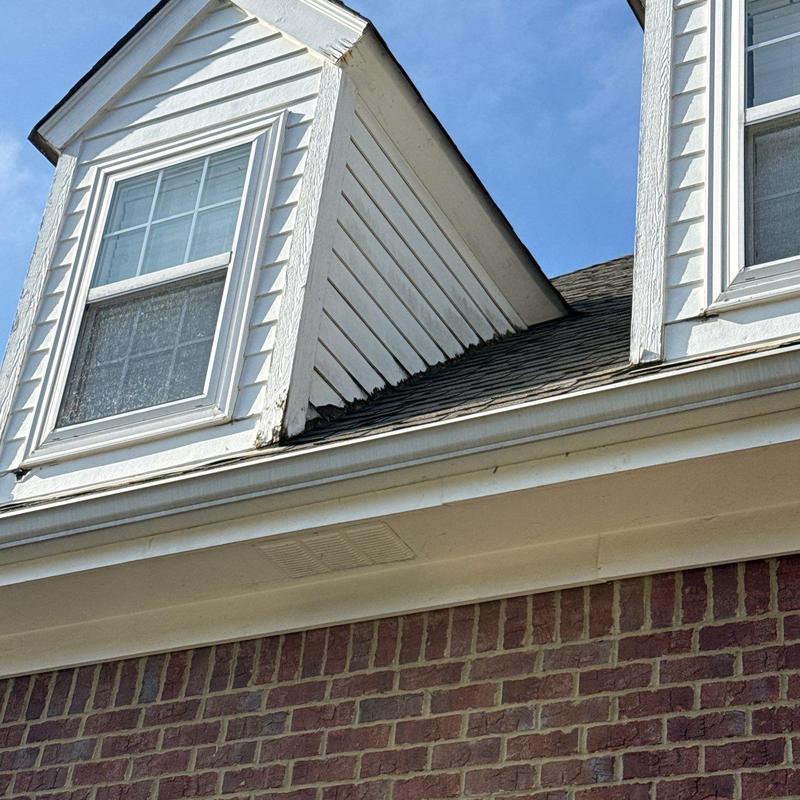 Asphalt shingle roof with dormer and gutter system