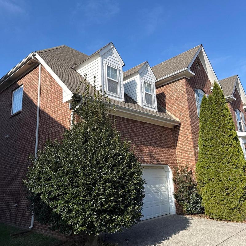 Asphalt shingle roof with dormer windows and gutters