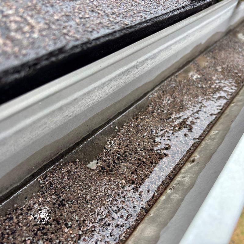 Roof flashing with hail damage and granule loss