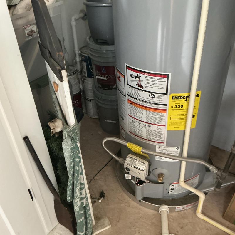 Water heater with gas line and drip leg installation