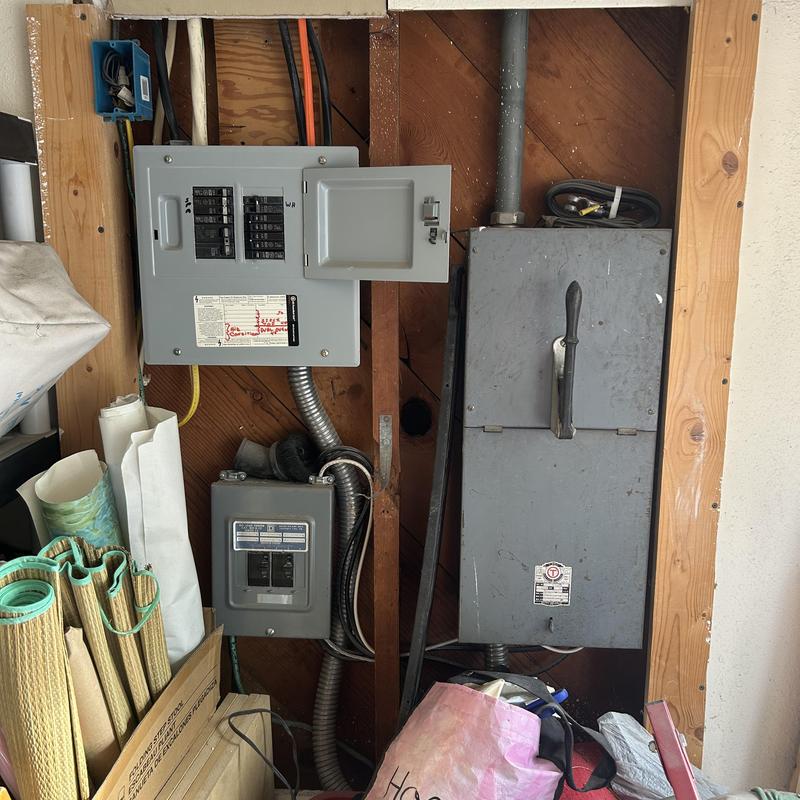Electrical disconnect box and circuit panels in garage
